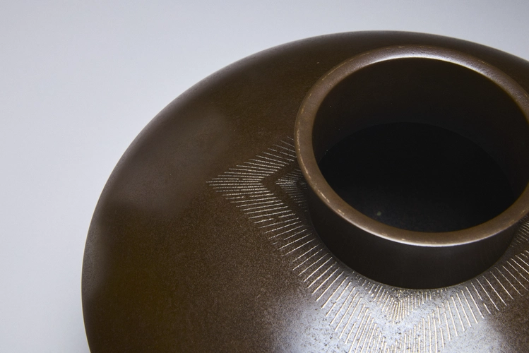 Flatted round bronze vase with fine silver inlay 