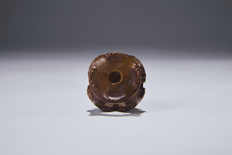 Boxwood Netsuke of a Shishi on a Table