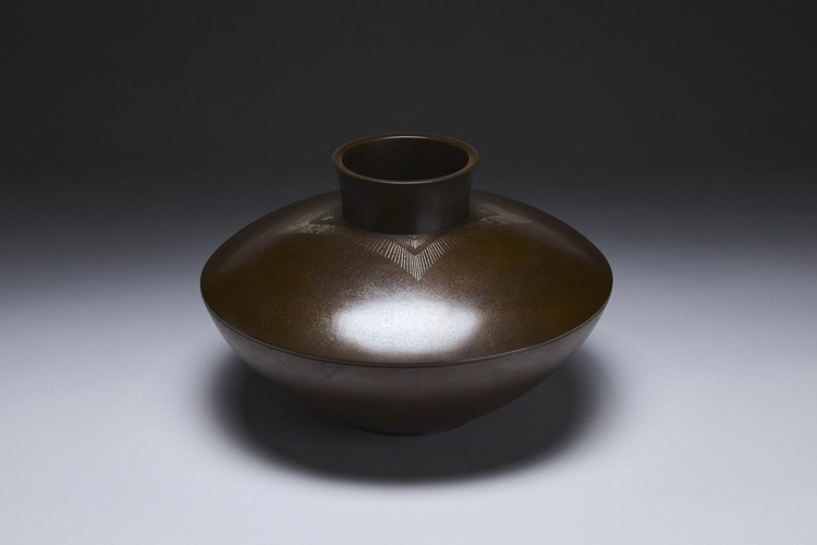 Flatted round bronze vase with fine silver inlay 
